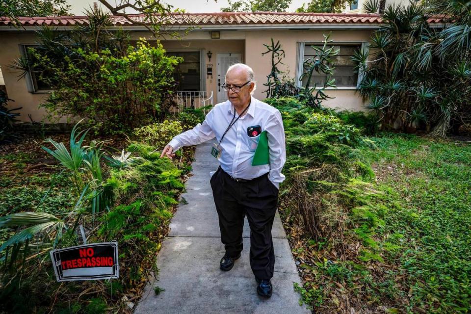 Orlando Capote speaks of his deceased parents and a recent Notice for Intent to Lien from the City of Coral Gables for code violations at his home stemming from a carport. Al Diaz/adiaz@miamiherald.com