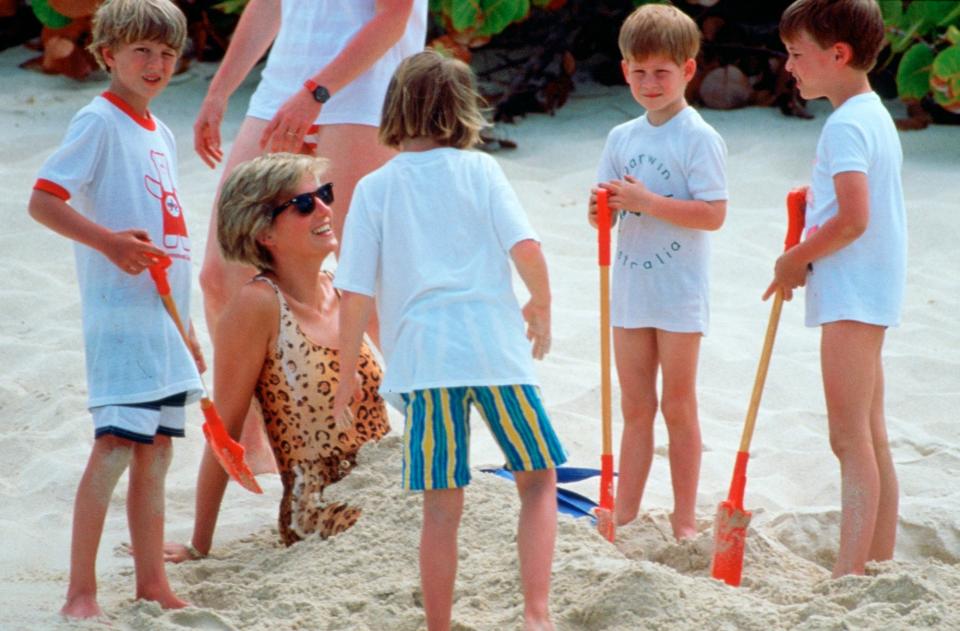 Prince Harry, Prince William, and friends bury Princess Diana in the sand on Necker Island in 1990.