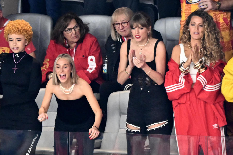 Taylor Swift, with rapper Ice Spice, Ashley Avignone and Blake Lively, cheering at Super Bowl LVIII in Las Vegas, on Feb. 11, 2024. / Credit: PATRICK T. FALLON/AFP via Getty Images