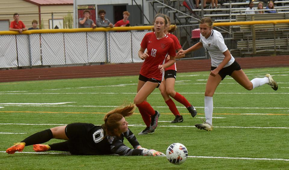 Worthington Christian senior goalkeeper Amelia Wilson dives after a wide shot from Licking Heights freshman Evelyn Caruso late in Saturday's game. The Hornets girls soccer lost 1-0 on the road to Worthington Christian.