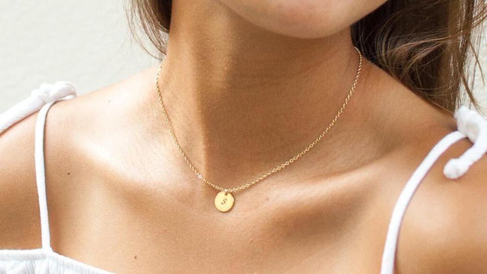 Gold Coin Initial Necklace. (Image via Etsy)