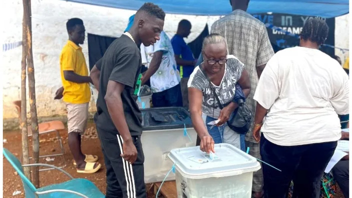 Woman voting in Sierra Leone