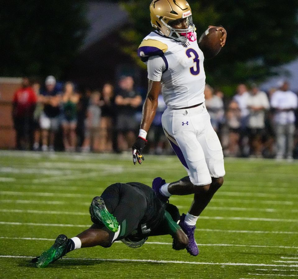 Male’s Antonio Harris breaks a Trinity block in the first half. Friday, September 20, 2024