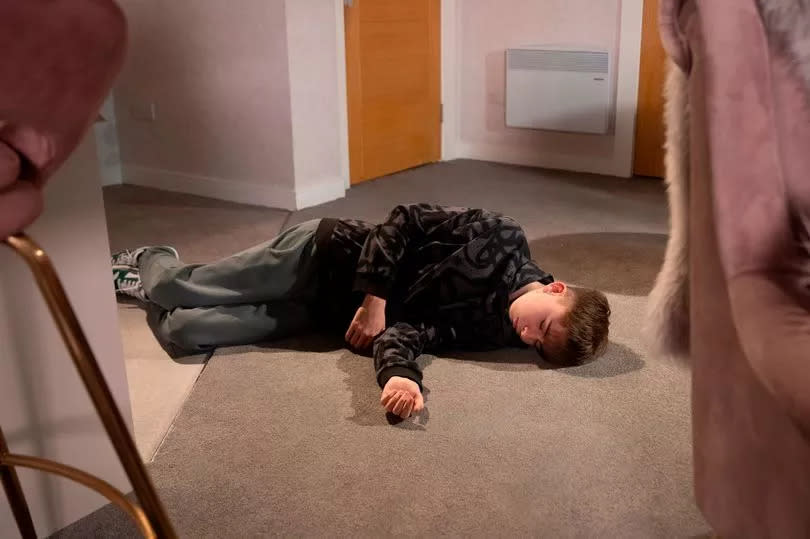 Liam is found collapses at the flat -Credit:ITV