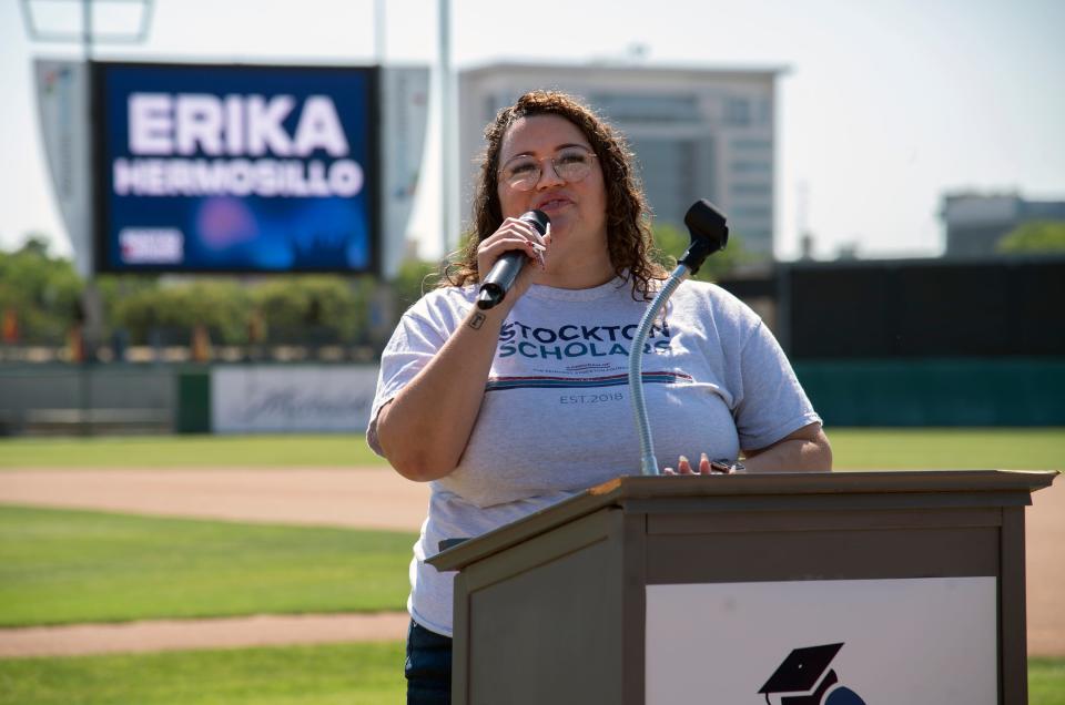 Stockton Scholars chief program officer Erika Hermosillo welcomes people to the organization's Rooted Rising event at the Stockton Ballpark in downtown Stockton on June 17, 2023.