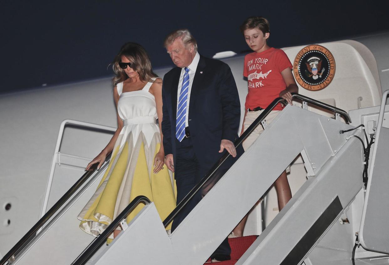 The US President arrived at Andrews Air Force Base, Maryland with first lady Melania Trump and son Barron Trump yesterday: AP