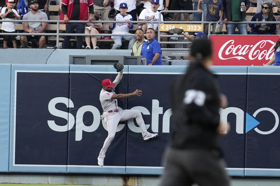 Los Angeles Angels left fielder Jo Adell makes a catch on a ball hit by Los Angeles Dodgers' Max Muncy during the first inning of a baseball game Friday, July 7, 2023, in Los Angeles. (AP Photo/Mark J. Terrill)