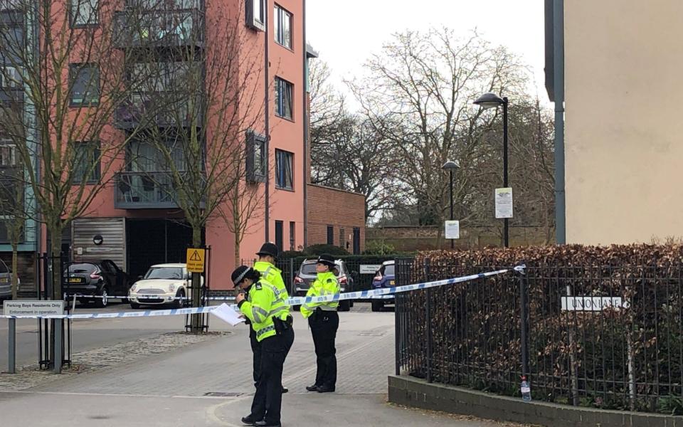 Police activity outside a block of flats on Union Lane, Isleworth, after a teenager was found fatally stabbed on Friday  - PA