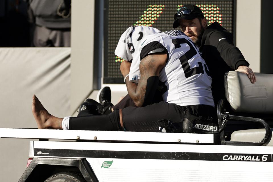 Jaguars running back James Robinson (25) is carted off the field during Sunday's game against the Jets. Robinson was diagnosed with a torn Achilles tendon, ending his season.