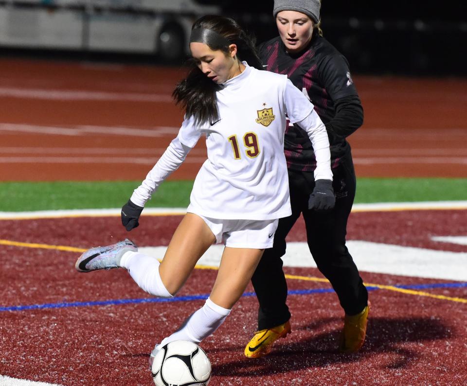 Arlington's Isabel Ren (19) controls the ball in front of Elmira's Addison Taft during Arlington's 6-0 victory over Elmira in a Class AAA girls soccer subregional Nov. 1 2023 at Johnson City High School.