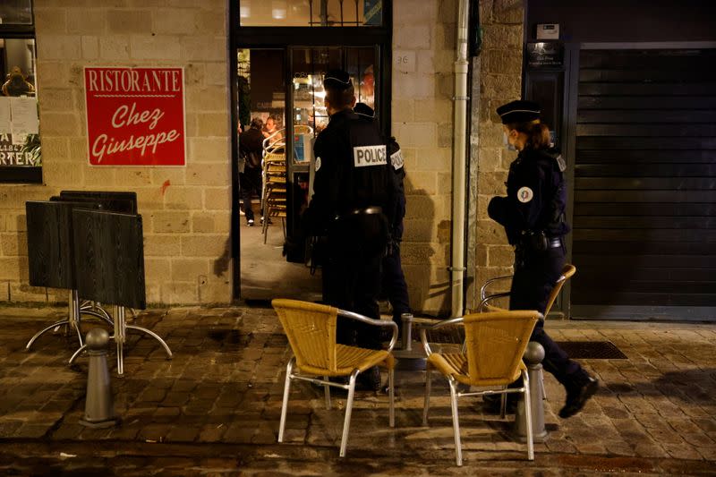 Police officers patrol in the streets of Lille during the start of the late-night curfew due to restrictions against the spread of the coronavirus disease (COVID-19), in Lille