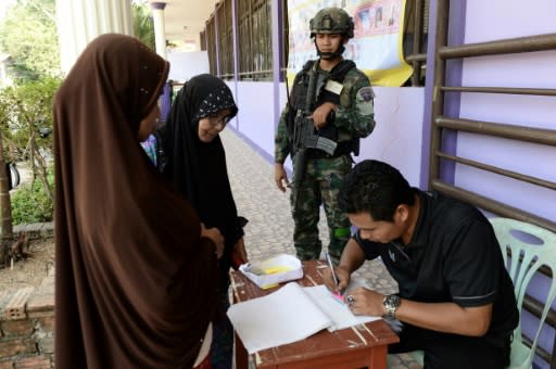 A soldier stands guard at a polling station in Narathiwat, in Thailand's 'Deep South' which has been in the grip of a low-level insurgency for more than a decade