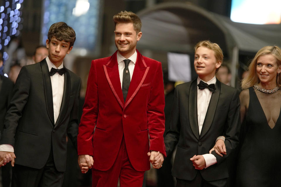 FILE - Gustav De Waele, from left, director Lukas Dhont, Eden Dambrine, and Emilie Dequenne pose for photographers upon arrival at the premiere of the film 'Close' at the 75th international film festival, Cannes, southern France, Thursday, May 26, 2022. The film is nominated for an Oscar for best international film. (AP Photo/Petros Giannakouris, File)