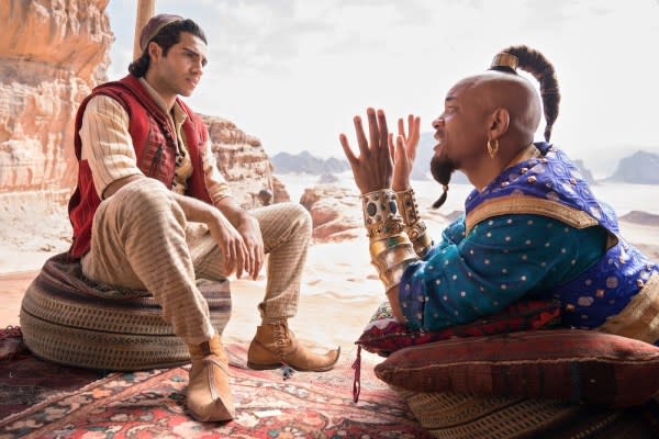 Aladdin (Mena Massoud) listens to Genie (Will Smith) about the rules of making wishes in Aladdin. Credit: Walt Disney Pictures