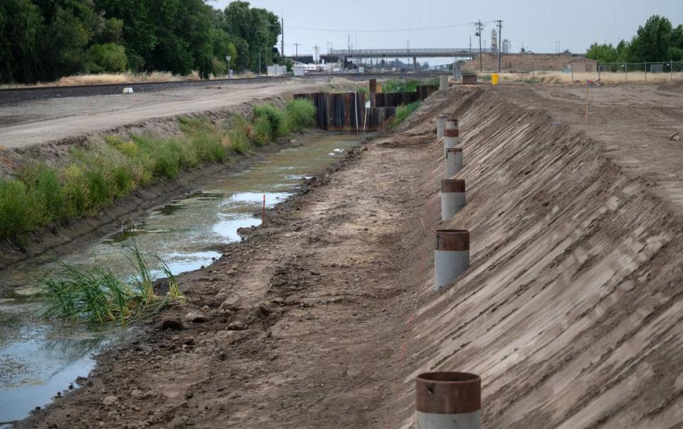 A coffer dam will divert water for the construction of a concrete box culvert to be installed along rail tracks in Lathrop to allow for a new rail connection for the Stanislaus County lines of the Altamont Commuter Express (ACE) train. Photographed in Lathrop, Calif., Tuesday, June 18, 2024.