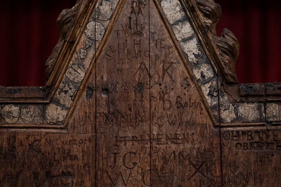 Detail of graffiti on the Coronation chair, at Westminster Abbey in London, which is being restored ahead of the upcoming coronation (PA)