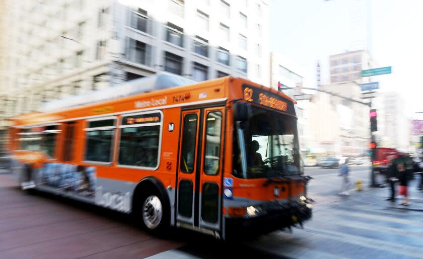 An L.A. Metro bus motors down Third Street in downtown Los Angeles on Aug. 7, 2015.