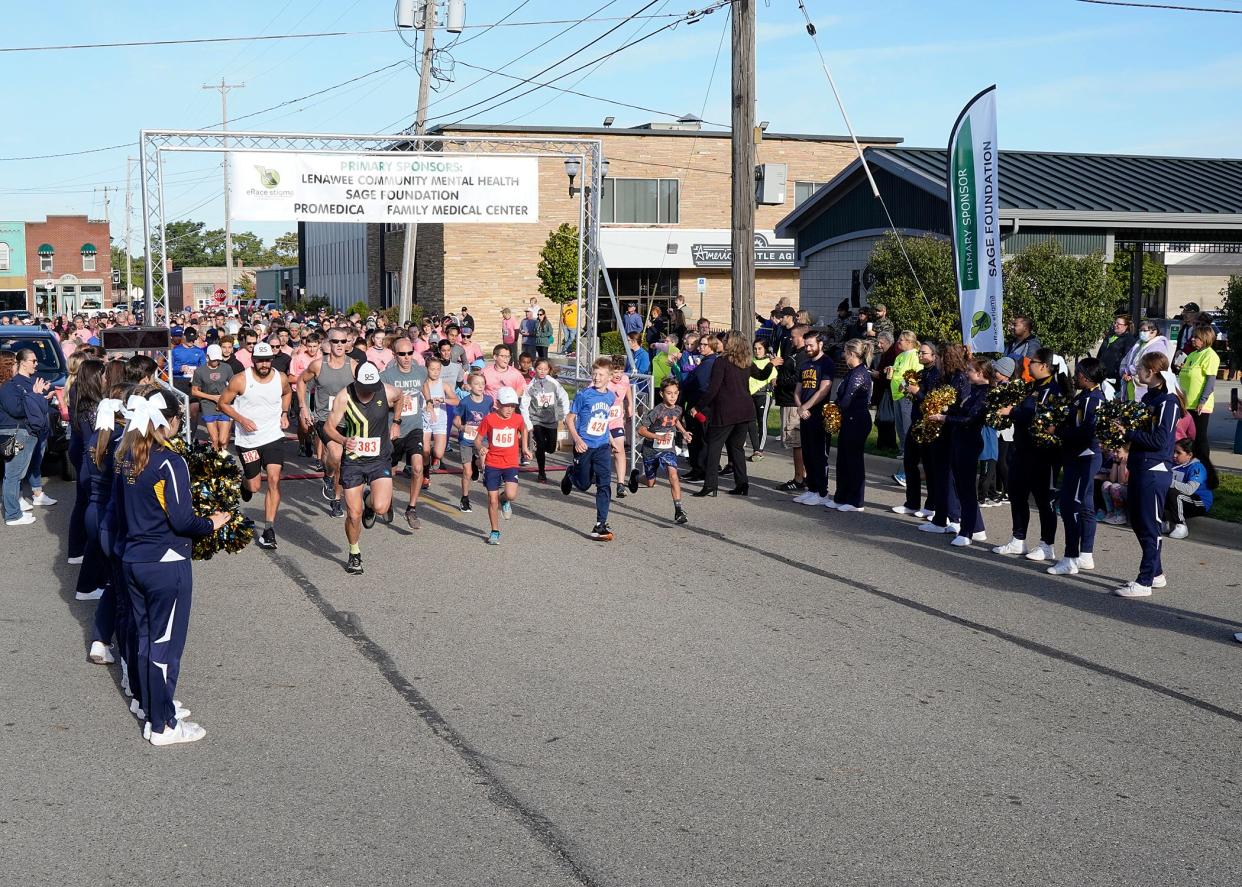 Participants head out on the e-Race the Stigma 5K Run, Walk and Kids Dash on Sept. 26, 2021, in downtown Adrian.