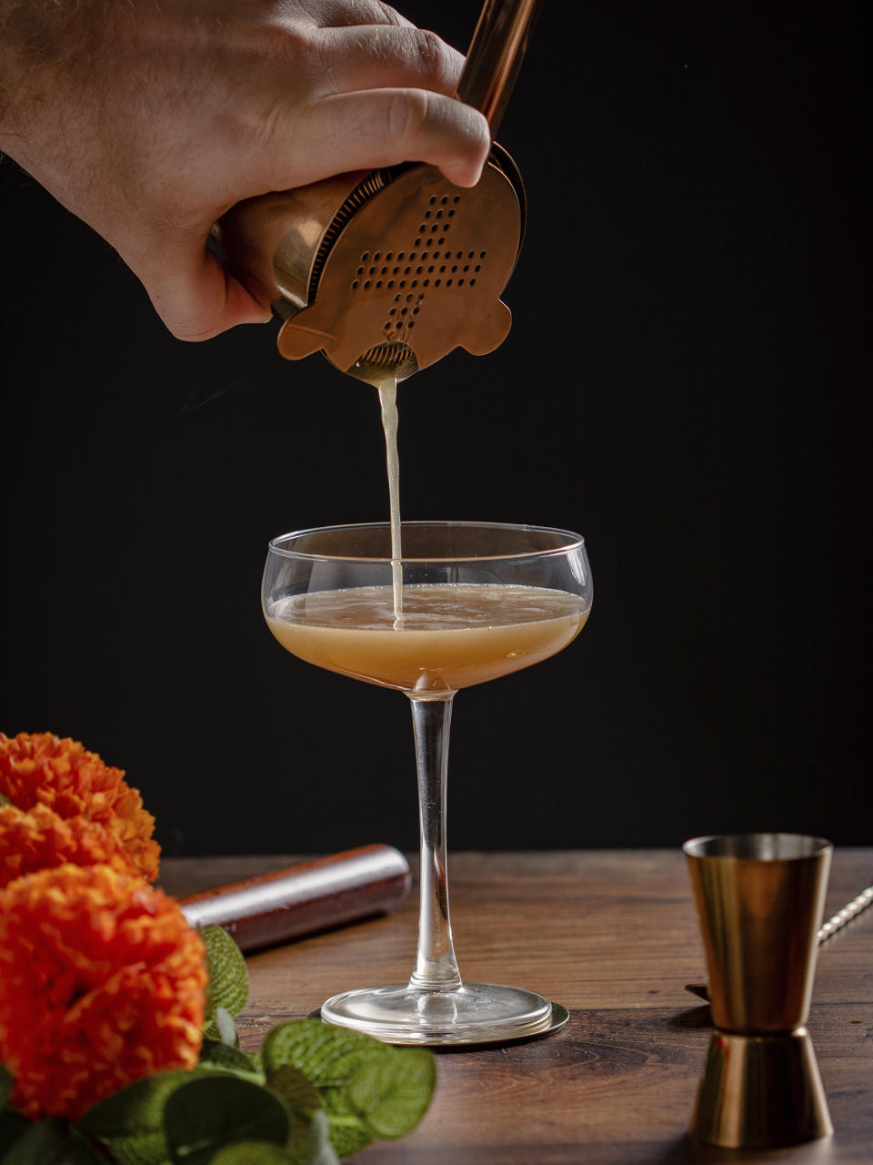 This image shows a pumpkin spice martini being prepared. (Callum Duffy via AP)