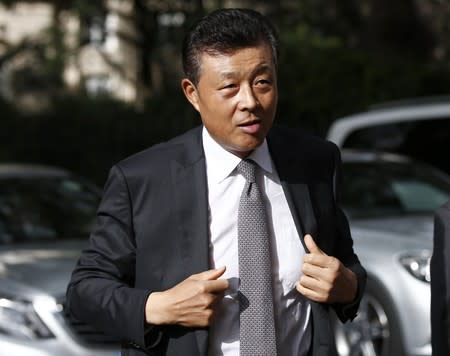 China's ambassador to Britain Liu Xiaoming arrives at 10 Carlton House Terrace in central London, where representatives from Britain, China, France and energy company EDF will sign an agreement to build a new nuclear power station at Hinkley Point