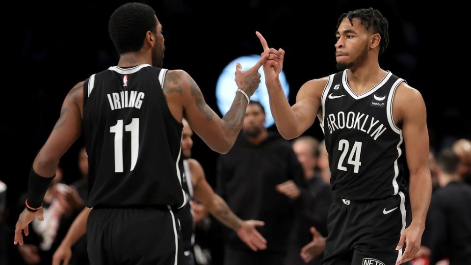 Jan 30, 2023; Brooklyn, New York, USA; Brooklyn Nets guards Kyrie Irving (11) and Cam Thomas (24) celebrate during the fourth quarter against the Los Angeles Lakers at Barclays Center.