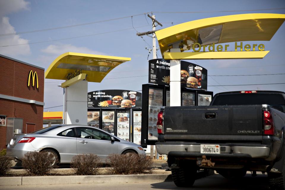 <span>A McDonald’s drive-thru in Illinois in 2019.</span><span>Photograph: Bloomberg/Getty Images</span>