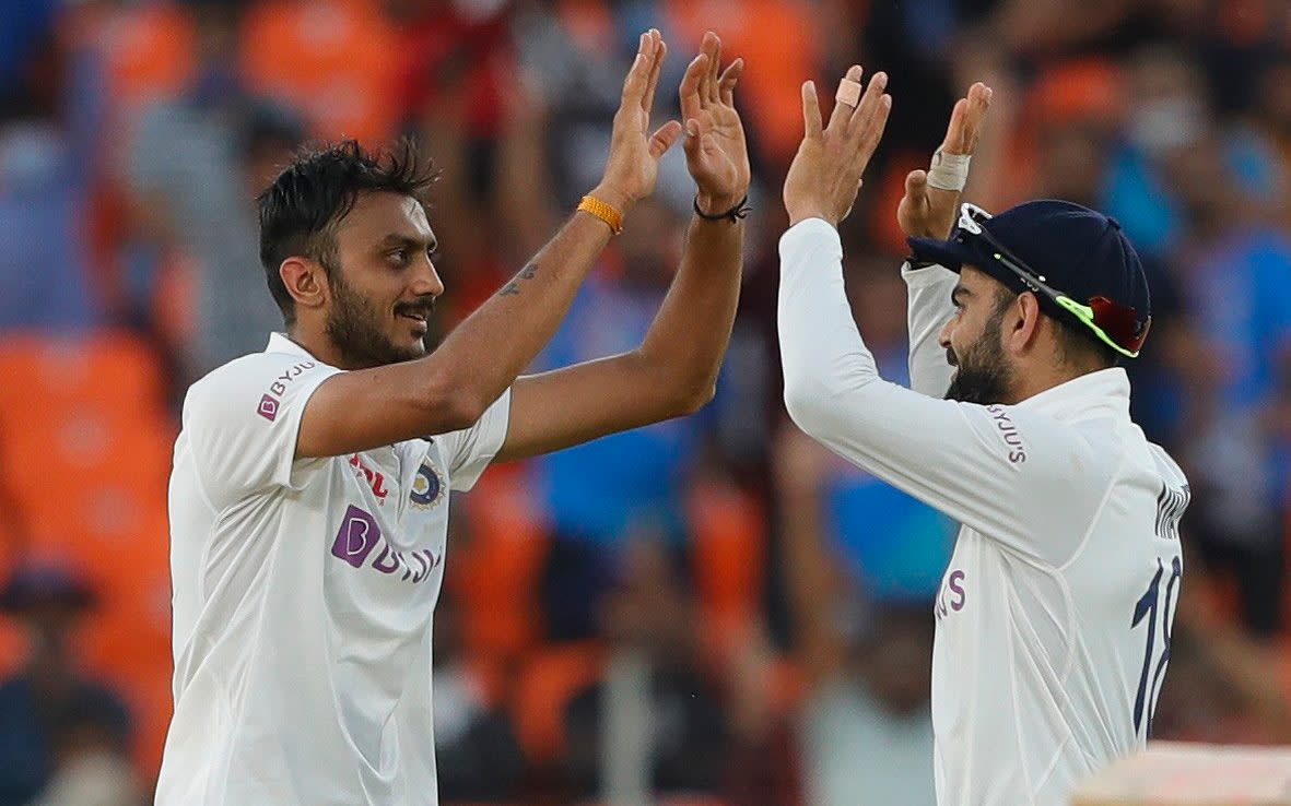 Man of the match, Axar Patel celebrates with Virat Kohli  - BCCI