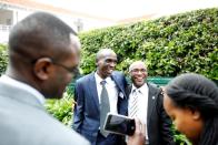 Kipchoge, the marathon world record holder, has his picture taken with a fan after an Interview with Reuters at the state house in Nairobi