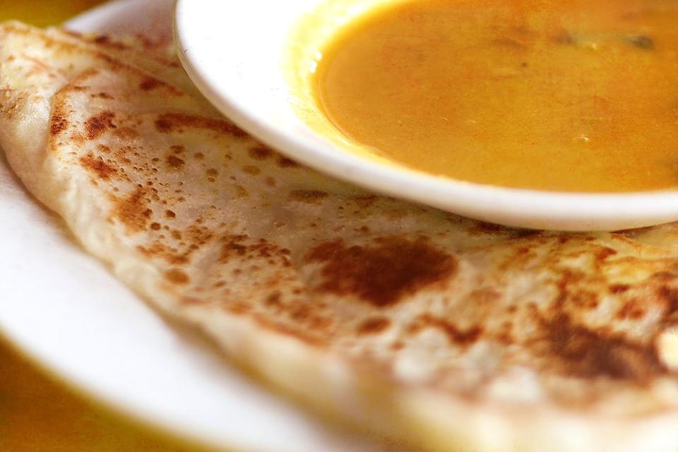 The simplest way to enjoy roti canai is with a saucer of mildly spiced 'dal'.