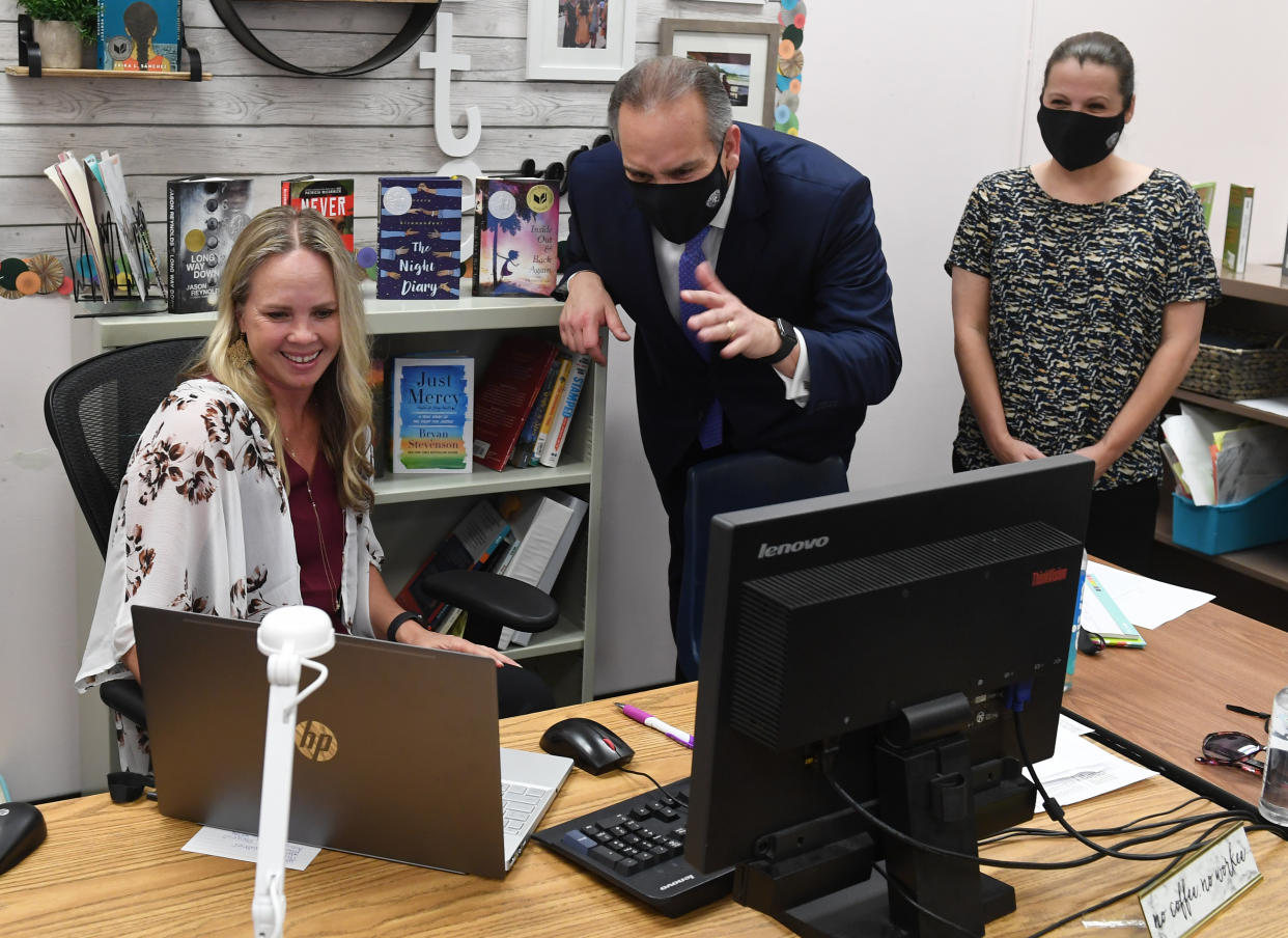 Instructors in Las Vegas are seen here starting remote learning in August 2020. Now, after returning to in-person learning, the district will take a five-day 