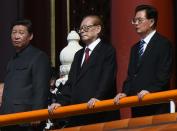 Chinese President Xi Jinping (left) with former presidents Jiang Zemin (centre) and Hu Jintao (right) attend a military parade at Tiananmen Square in Beijing on September 3, 2015