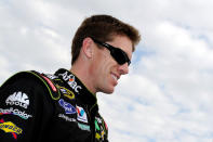 FORT WORTH, TX - NOVEMBER 06: Carl Edwards, driver of the #99 Aflac Ford, smiles as he stands on the grid prior to the start of the NASCAR Sprint Cup Series AAA Texas 500 at Texas Motor Speedway on November 6, 2011 in Fort Worth, Texas. (Photo by John Harrelson/Getty Images for NASCAR)