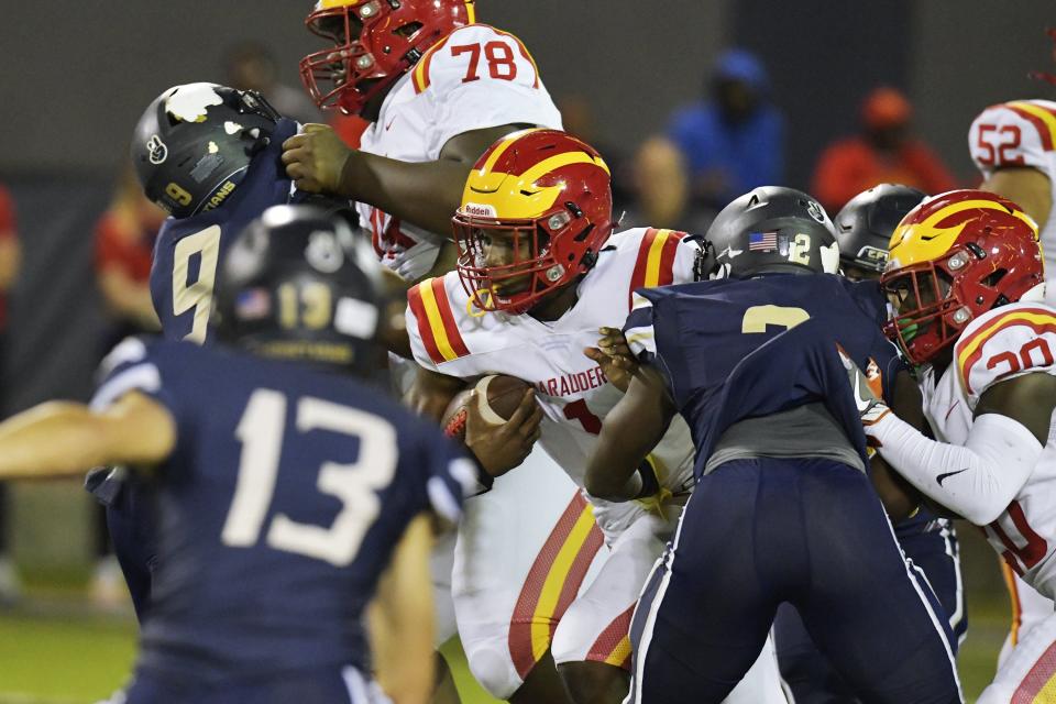 Clearwater Central Catholic's Quarterback Jershaun Newton (1) scrambles for yardage during late first quarter action. The Clearwater Central Catholic Marauders traveled to Jacksonville, FL to take on the University Christian Christians in the Florida High School Athletic Association Class 1M starts football semifinal match Friday, December 2, 2022. The Marauders came away with a 29 to 34 win over the Christians. [Bob Self/Florida Times-Union]