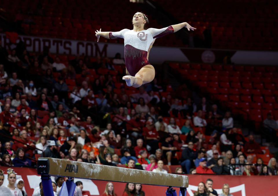 Oklahoma's Ava Siegfeldt competes in the balance beam against Utah at the Lloyd Noble Center in Norman, Okla., Sunday, Jan. 22, 2023.