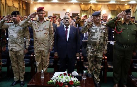 Iraqi Prime Minister Adel Abdul Mahdi attends the celebration ceremony of the first anniversary of defeating Islamic state in Baghdad, Iraq, December 10, 2018. Iraqi Prime Minister Media Office/Handout via REUTERS
