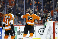 Philadelphia Flyers' Kevin Hayes (13) celebrates with Scott Laughton (21) after scoring a goal during the second period of an NHL hockey game against the San Jose Sharks, Tuesday, Feb. 25, 2020, in Philadelphia. (AP Photo/Matt Slocum)