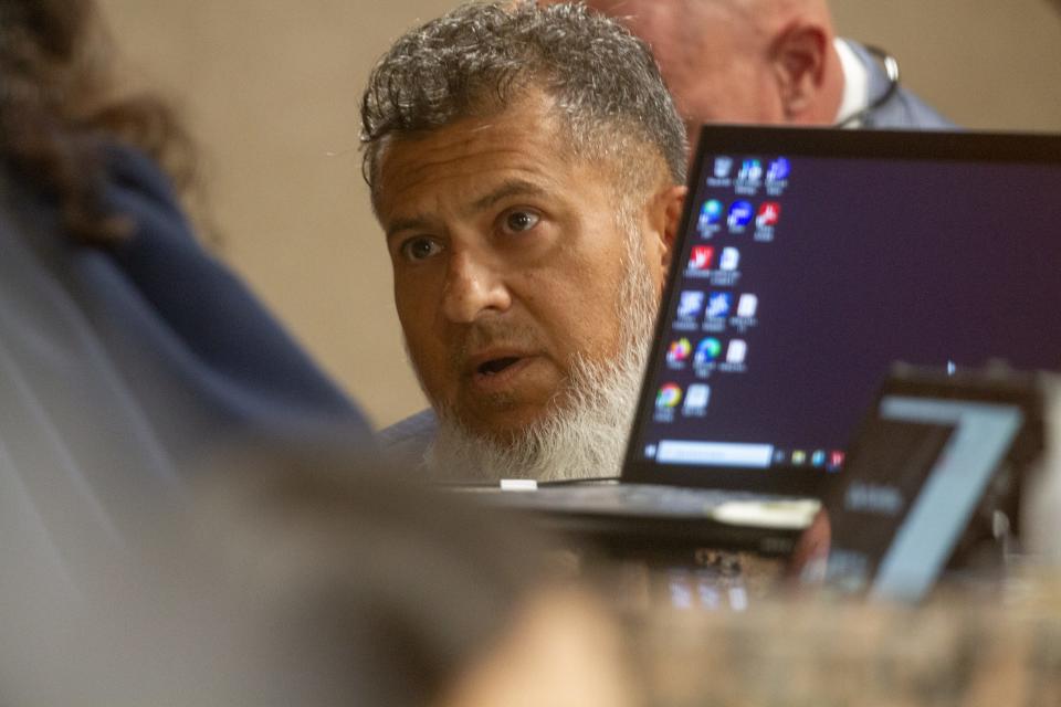 Louis Lopez, a defense attorney for Facundo Chavez,  talks to Judge Diane Navarrette on the first day of the capital murder case of Peter Herrera on July 26, 2023