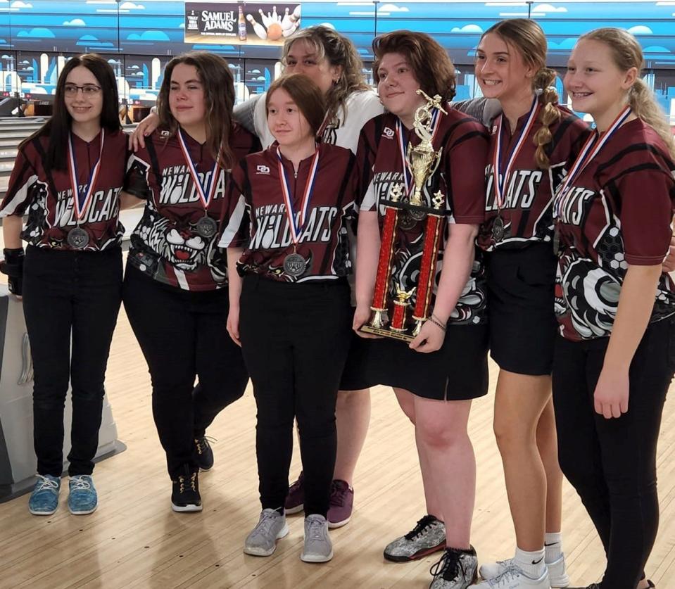 The Newark girls finished 2nd out of 14 teams Saturday in the Muskingum University Invitational at Park Lanes. Coach Denise Wiley is in the background and Jade Gabor holds the trophy. Other team members include Andy Hupp, Nadia Liesen, Makaila Adams, Amelia Bueno and Caitlyn Parker.