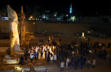 General view of tourists surrounding the newly renovated statue of Ramses II, from 70 broken pieces to a full colossus, Sohag, Egypt April 5, 2019. REUTERS/Mohamed Abd El Ghany