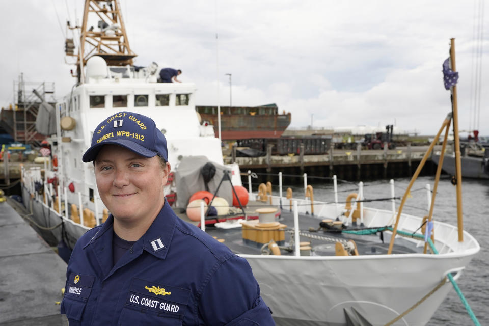 U.S. Coast Guard Lt. Kelli Normoyle, Commanding Officer of the Coast Guard Cutter Sanibel, stands for a photograph near the vessel, Thursday, Sept. 16, 2021, at a shipyard in North Kingstown, R.I. Normoyle was one of two cadets who formally started the process to create the CGA Spectrum Diversity Council just a few months after the law known as "don't ask, don't tell" was repealed on Sept. 20, 2011. (AP Photo/Steven Senne)