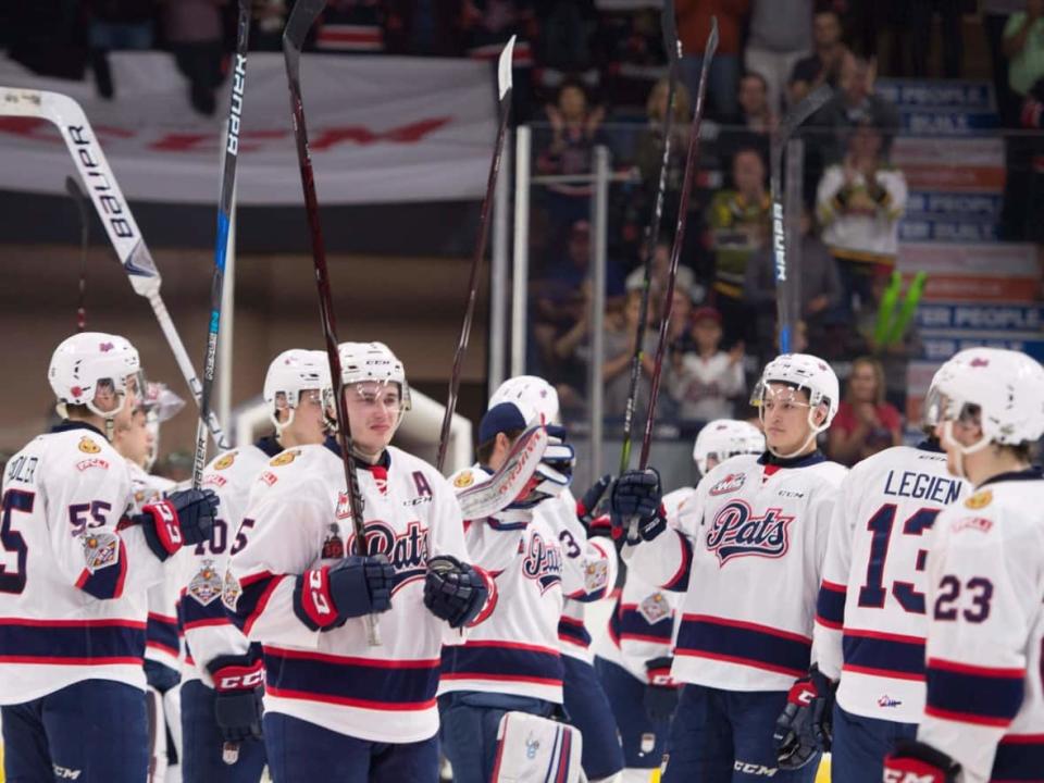 The Regina Pats were among more than a dozen teams included in an announcement on Friday that their activities had been paused. Pictured here, the Pats acknowledge the crowd after being defeated by the Acadie-Bathurst Titan following the Memorial Cup final in 2018.  (Jonathan Hayward/The Canadian Press - image credit)