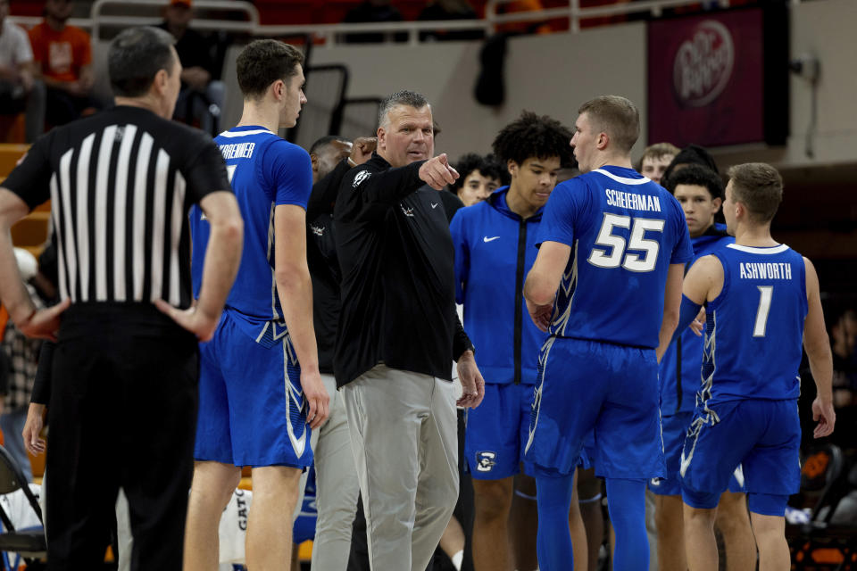 Creighton head coach Greg McDermott talks with center Ryan Kalkbrenner and guard Baylor Scheierman (55) in the second half of an NCAA college basketball game against Oklahoma State, Thursday, Nov. 30, 2023, in Stillwater, Okla. (AP Photo/Mitch Alcala)