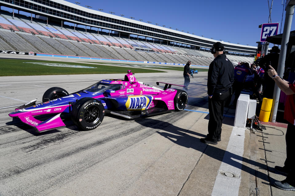 Alexander Rossi pulls out of his pit during the first practice round of the IndyCar Series auto race at Texas Motor Speedway in Fort Worth, Texas on Saturday, March 19, 2022. (AP Photo/Larry Papke)