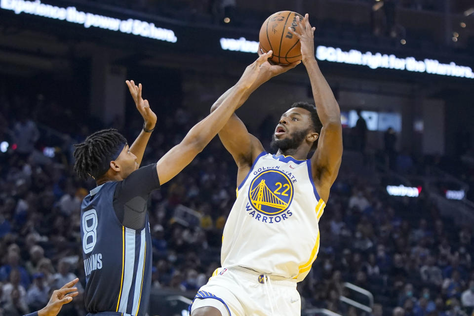 Golden State Warriors forward Andrew Wiggins (22) shoots against Memphis Grizzlies guard Ziaire Williams (8) during the first half of an NBA basketball game in San Francisco, Thursday, Oct. 28, 2021. (AP Photo/Jeff Chiu)