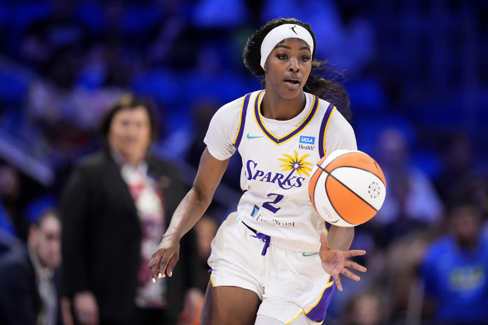 Rickea Jackson of the Los Angeles Sparks handles the ball during a WNBA basketball game against the Dallas Wings in Arlington, Texas, Saturday, July 13, 2024. (AP Photo/Tony Gutierrez)