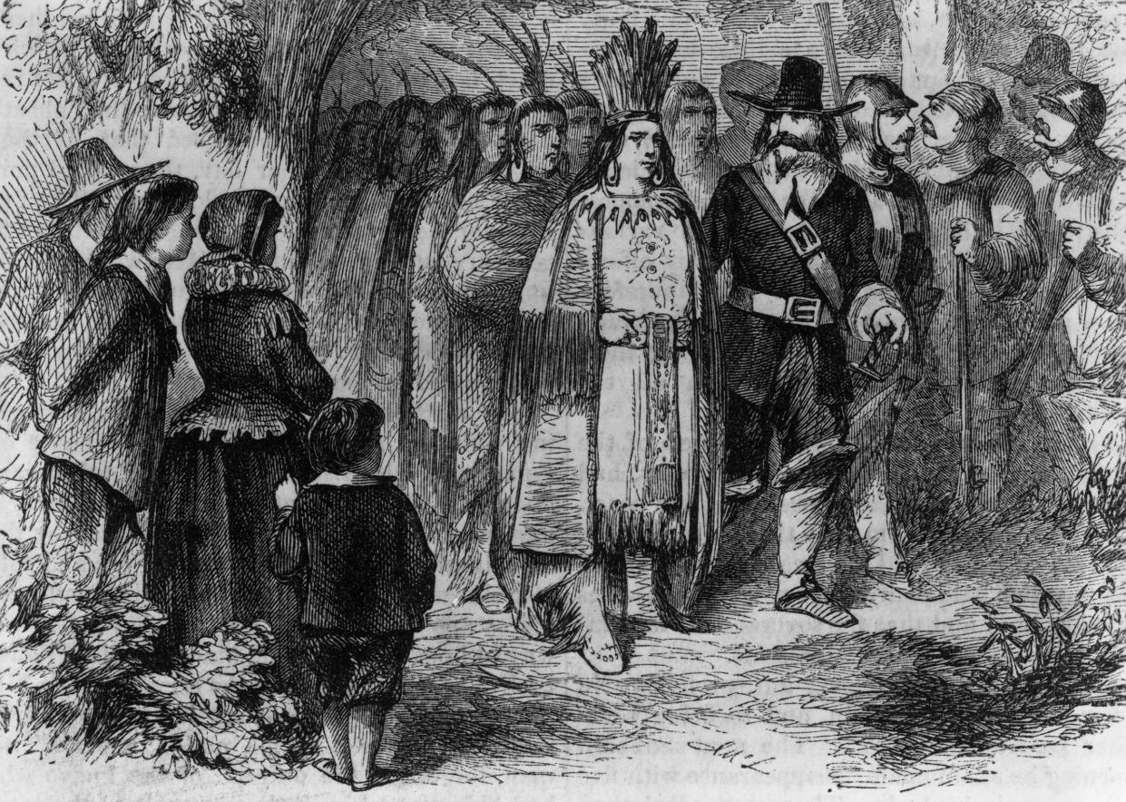 Circa 1621, Massasoit or Ousamequin, chief of the Wampanoag of Massachusetts and Rhode Island pays a friendly visit to the Pilgrims' camp at Plymouth Colony with his warriors after signing the earliest recorded treaty in New England with Governor Jo