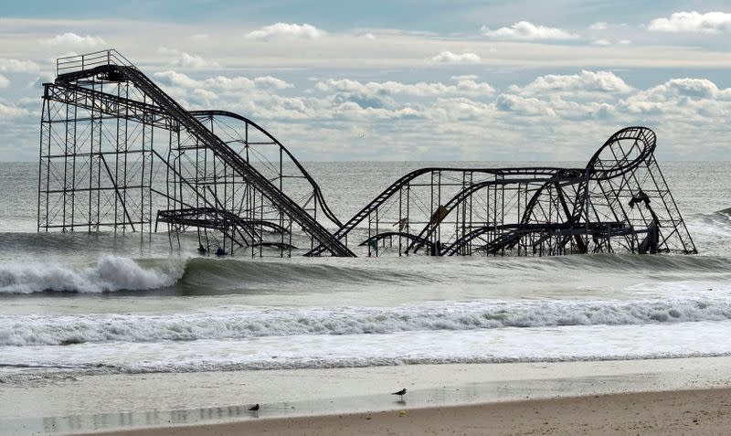 FILE PHOTO: The remnants of a roller coaster sits in the surf three days after Hurricane Sandy came ashore in Seaside Heights