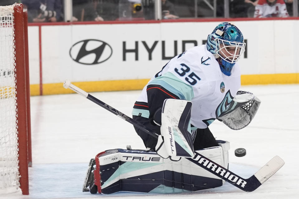 Seattle Kraken goaltender Joey Daccord makes a save during the second period of an NHL hockey game against the New Jersey Devils in Newark, N.J., Monday, Feb. 12, 2024. (AP Photo/Seth Wenig)