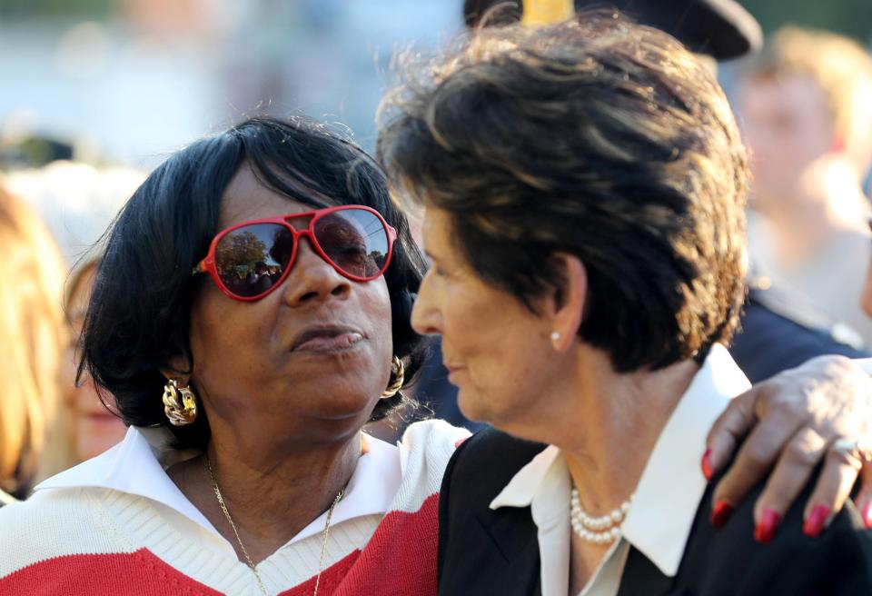 Constance Frazier, cousin of Nyack police officer Waverly "Chipper" Brown, puts her arm around Diane O'Grady, widow of Nyack police Sgt. Edward O'Grady, Jr hugs , during the 40th annual Brinks Memorial Service in Nyack Oct. 20, 2021. O'Grady and Brown were both killed in the Brinks armored car robbery on Oct. 20, 1981. Also killed in the robbery was Brinks guard Peter Paige.