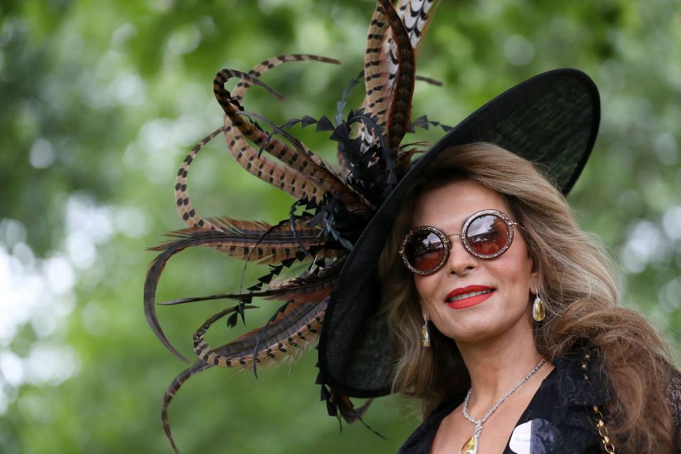 A racegoer's hat on the first day of Royal Ascot looks as if its sprouting a flower.